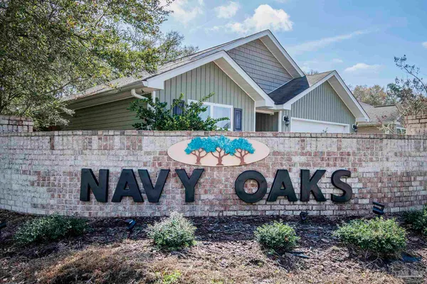a front view of house with sign board