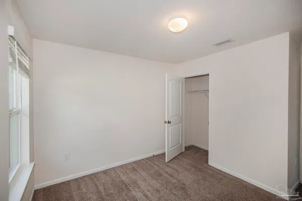 a bathroom with a granite countertop toilet a sink and a bathtub