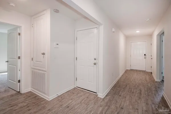 a view of a chandelier fan and window