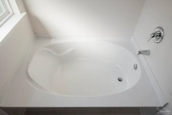 a bathroom that has a glass shower door