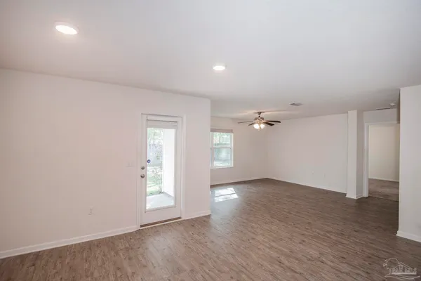 a kitchen that has a sink a stove and a refrigerator
