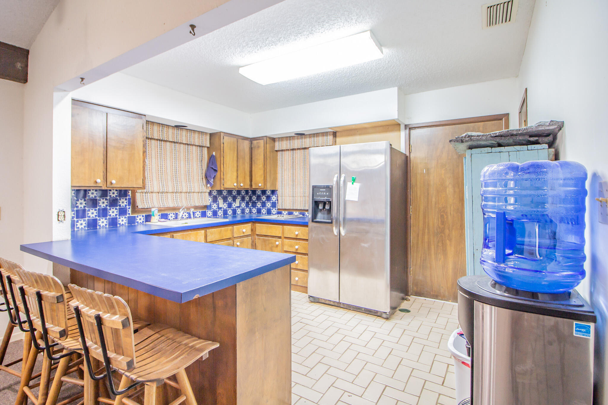1181 Fm 2236 Ralls, TX 79357 - Photo 34 of 42 a view of a kitchen area with furniture and wooden floor