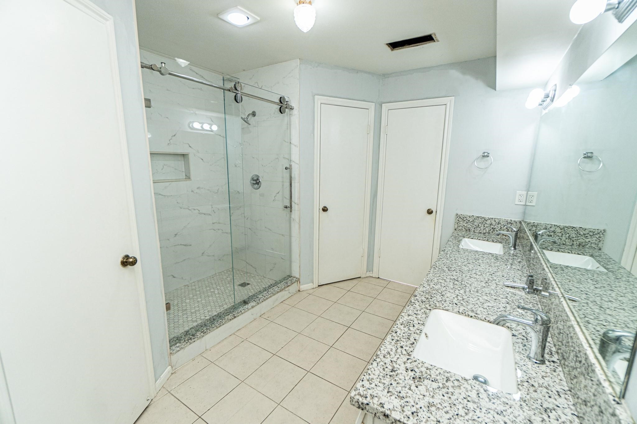 10903 Nobility Drive Houston, TX 77099 - Photo 10 of 12 a bathroom with a shower and a sink