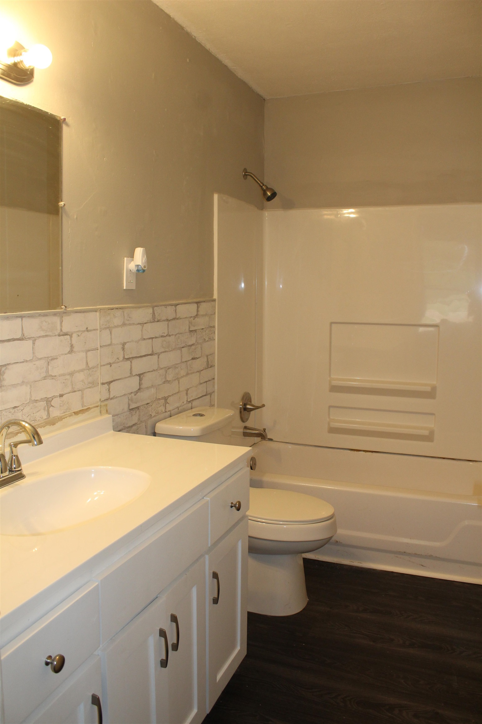 1367 Central Curve Road Ripley, TN 38063 - Photo 16 of 26 a bathroom with a sink a toilet and shower