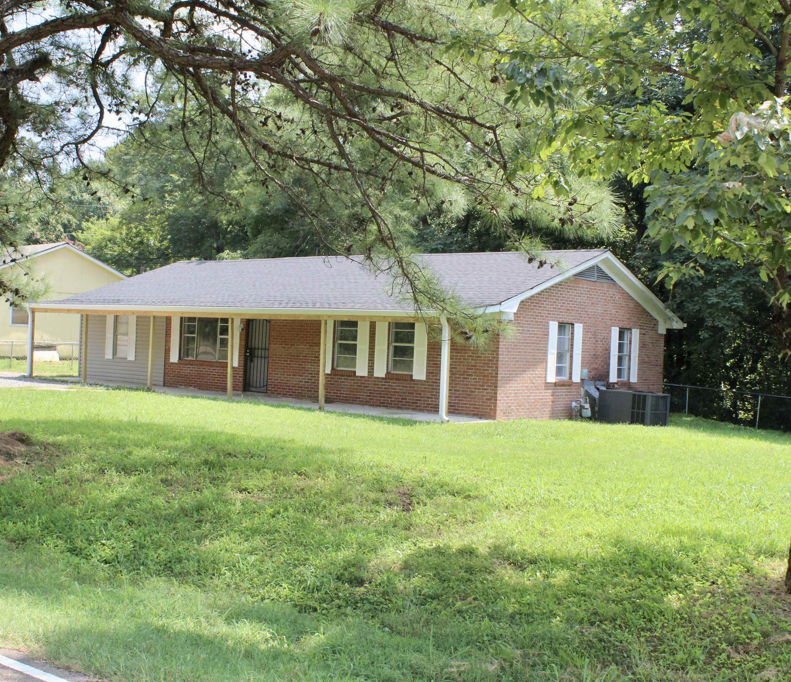 1367 Central Curve Road Ripley, TN 38063 - Photo 24 of 26 a front view of a house with yard and green space
