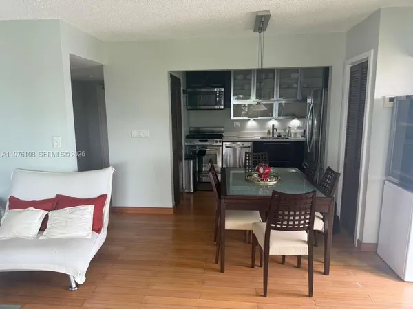 a kitchen with a table and chairs in it