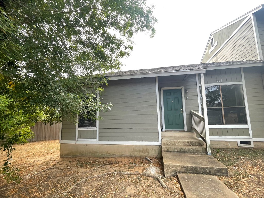 a house with trees in the background