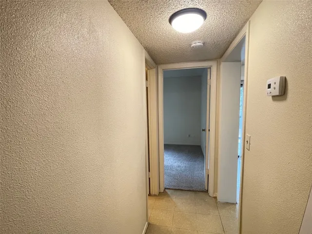 an empty room with closet area