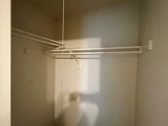 a room with a close up view of a shower