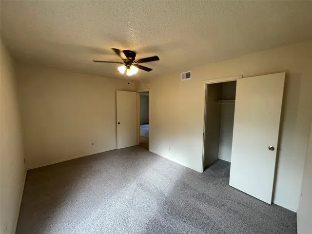 an empty room with a bathroom