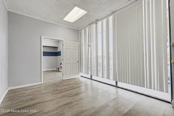 a view of a livingroom with wooden floor