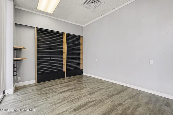 a view of an empty room with a closet