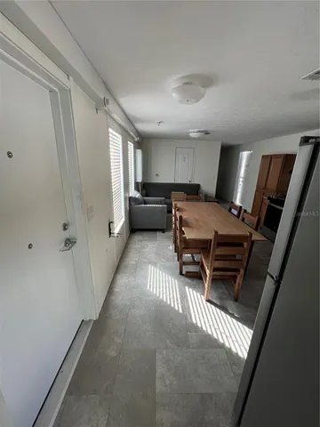 a living room with furniture and a rug