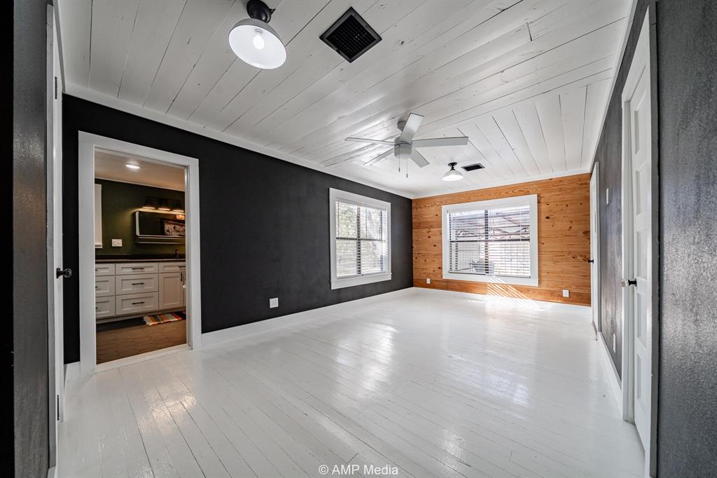 1002 Maple Street Stamford, TX 79553 - Photo 18 of 40 a view of an empty room with window and cabinet