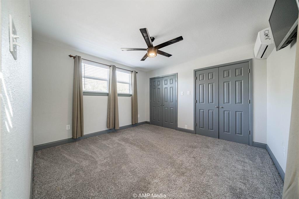 1002 Maple Street Stamford, TX 79553 - Photo 25 of 40 a view of empty room with windows