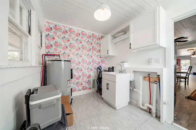 a room with furniture a washer and dryer