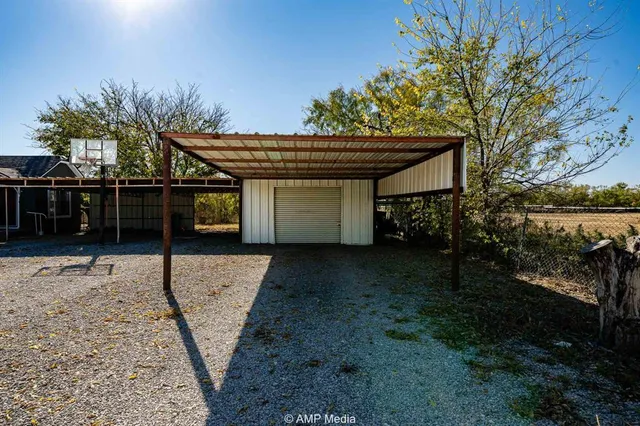 a view of a house with a yard and tree s
