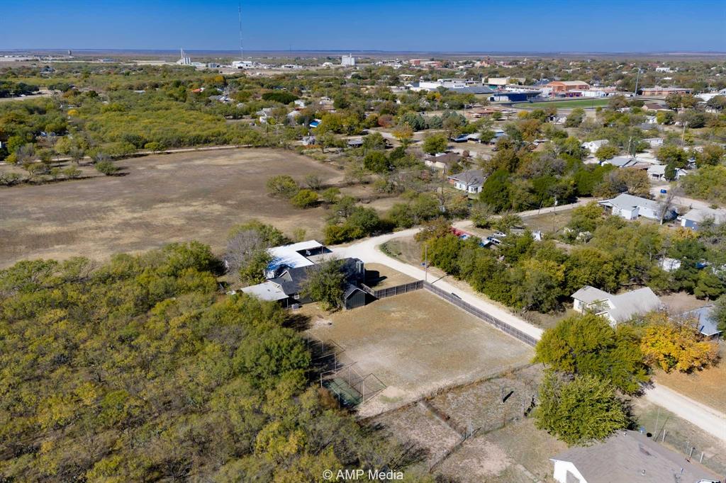 1002 Maple Street Stamford, TX 79553 - Photo 40 of 40 an aerial view of a house with a yard