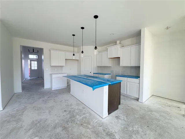 a view of a big room with closet and windows