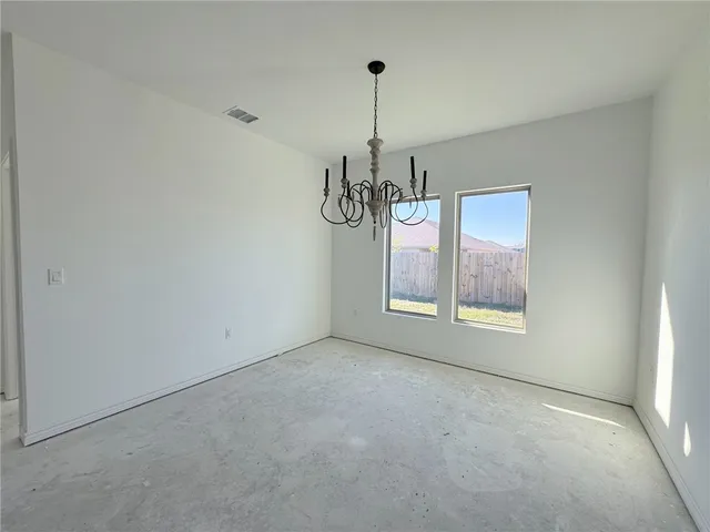 a kitchen with kitchen island a counter top and a stove