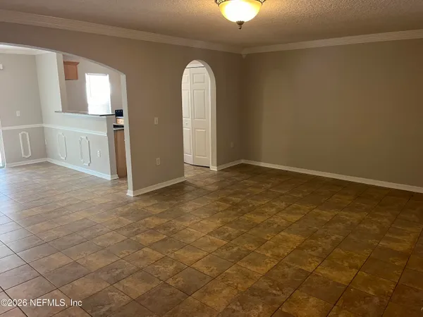 an empty room with a empty space and windows