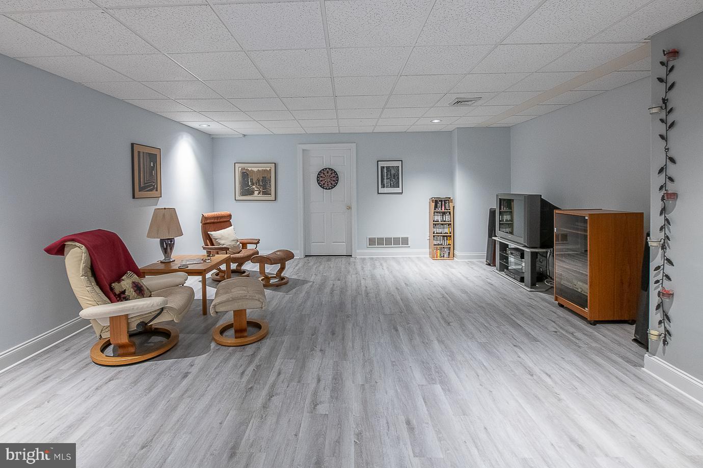 125 South Valley Road Paoli, PA 19301 - Photo 55 of 78 Spacious recreation room with new plank flooring.