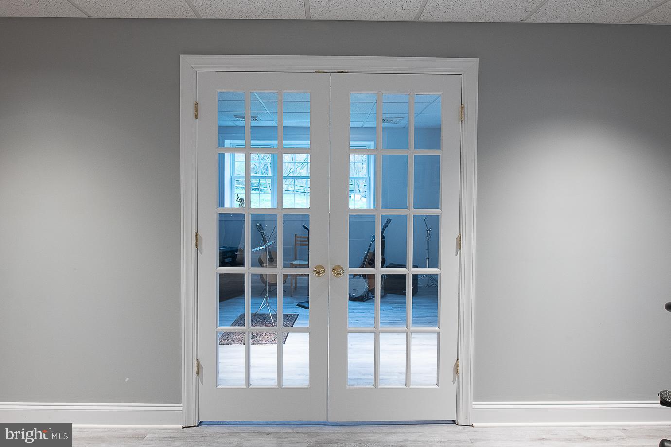 125 South Valley Road Paoli, PA 19301 - Photo 58 of 78 Double doors lead into the music room.