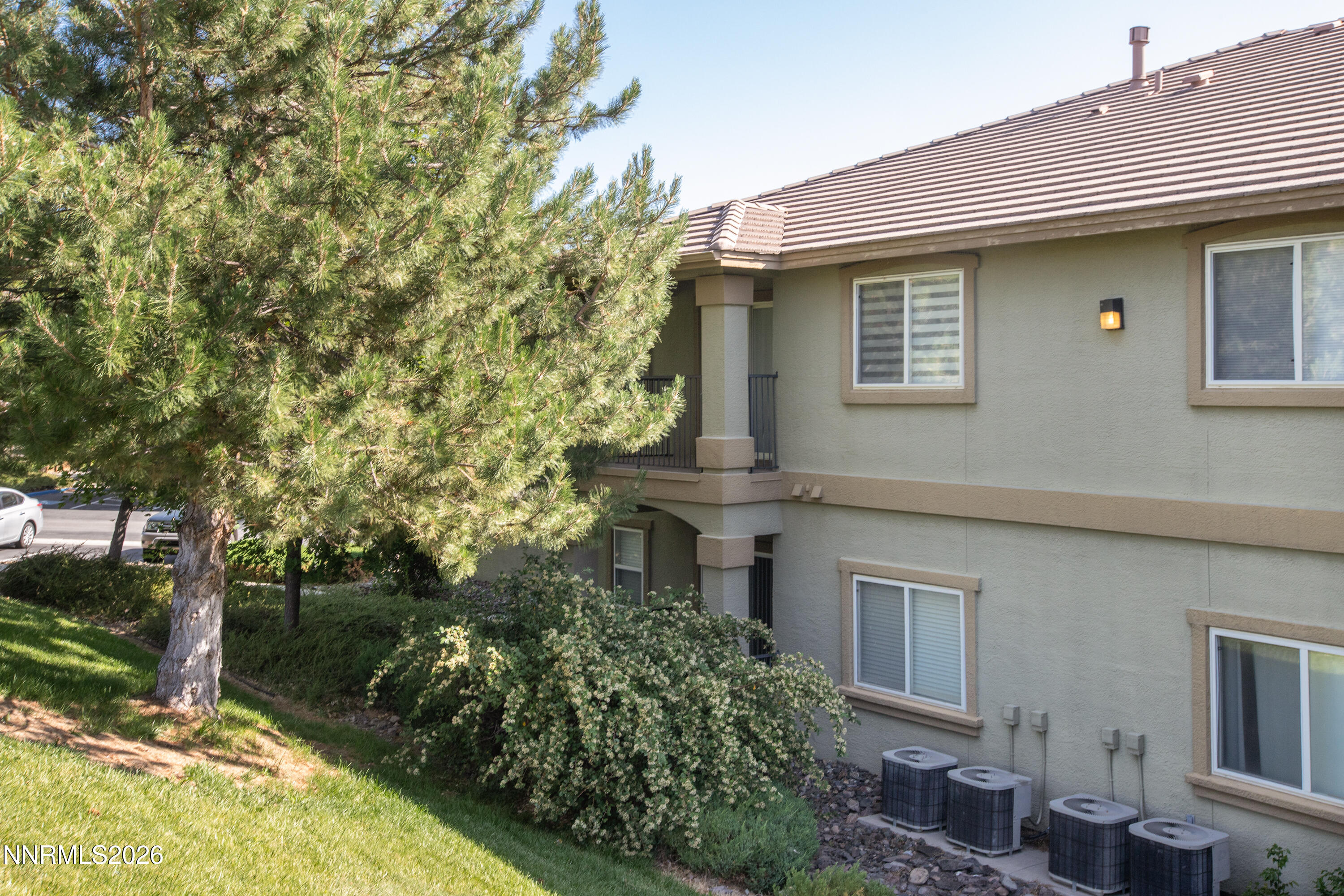 6850 Sharlands Avenue, Unit E 2022 Reno, NV 89523 - Photo 4 of 19 a house that has a tree in front of the house
