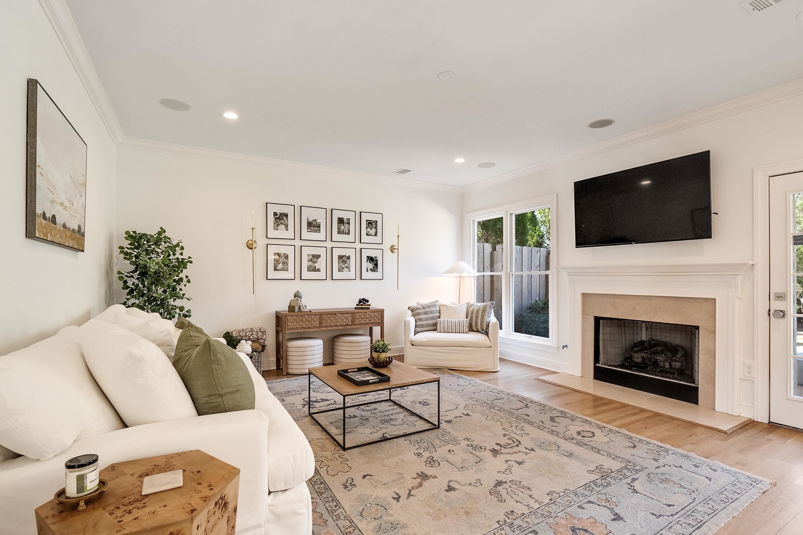 1870 Lonhill Drive Collierville, TN 38017 - Photo 13 of 34 a living room with furniture a flat screen tv and a fireplace