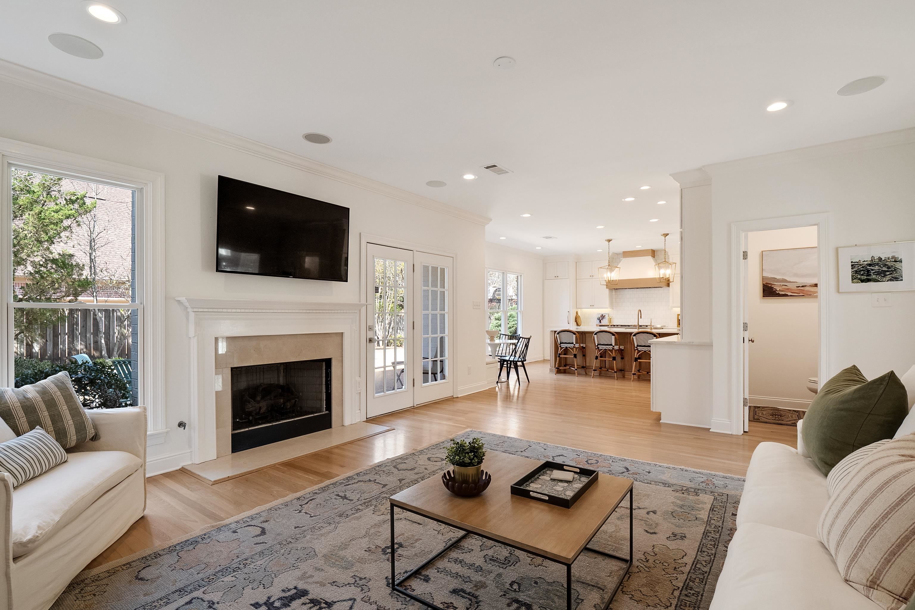 1870 Lonhill Drive Collierville, TN 38017 - Photo 14 of 34 a living room with furniture a flat screen tv and a fireplace