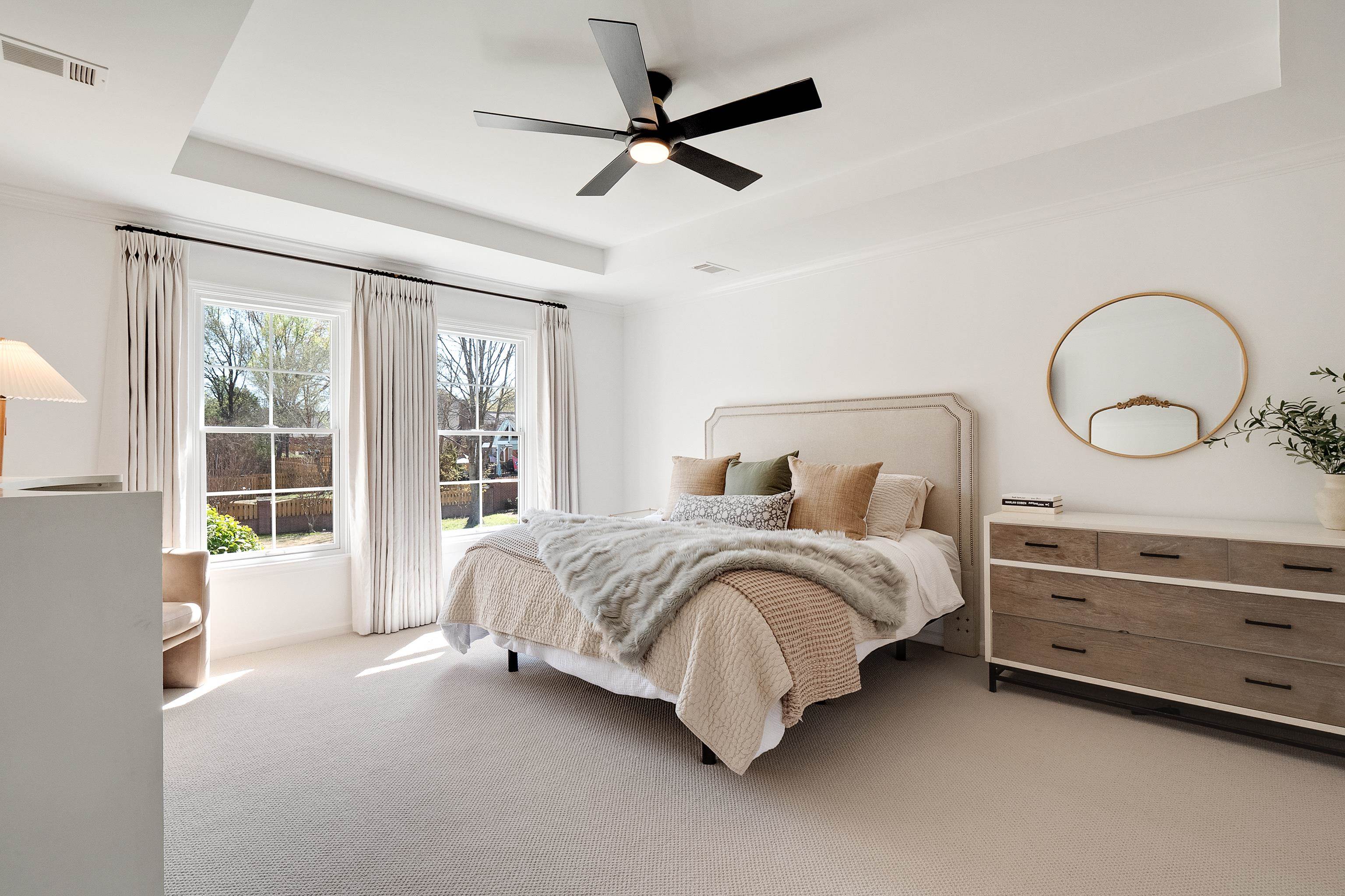 1870 Lonhill Drive Collierville, TN 38017 - Photo 18 of 34 a spacious bedroom with a bed a dresser and a chandelier