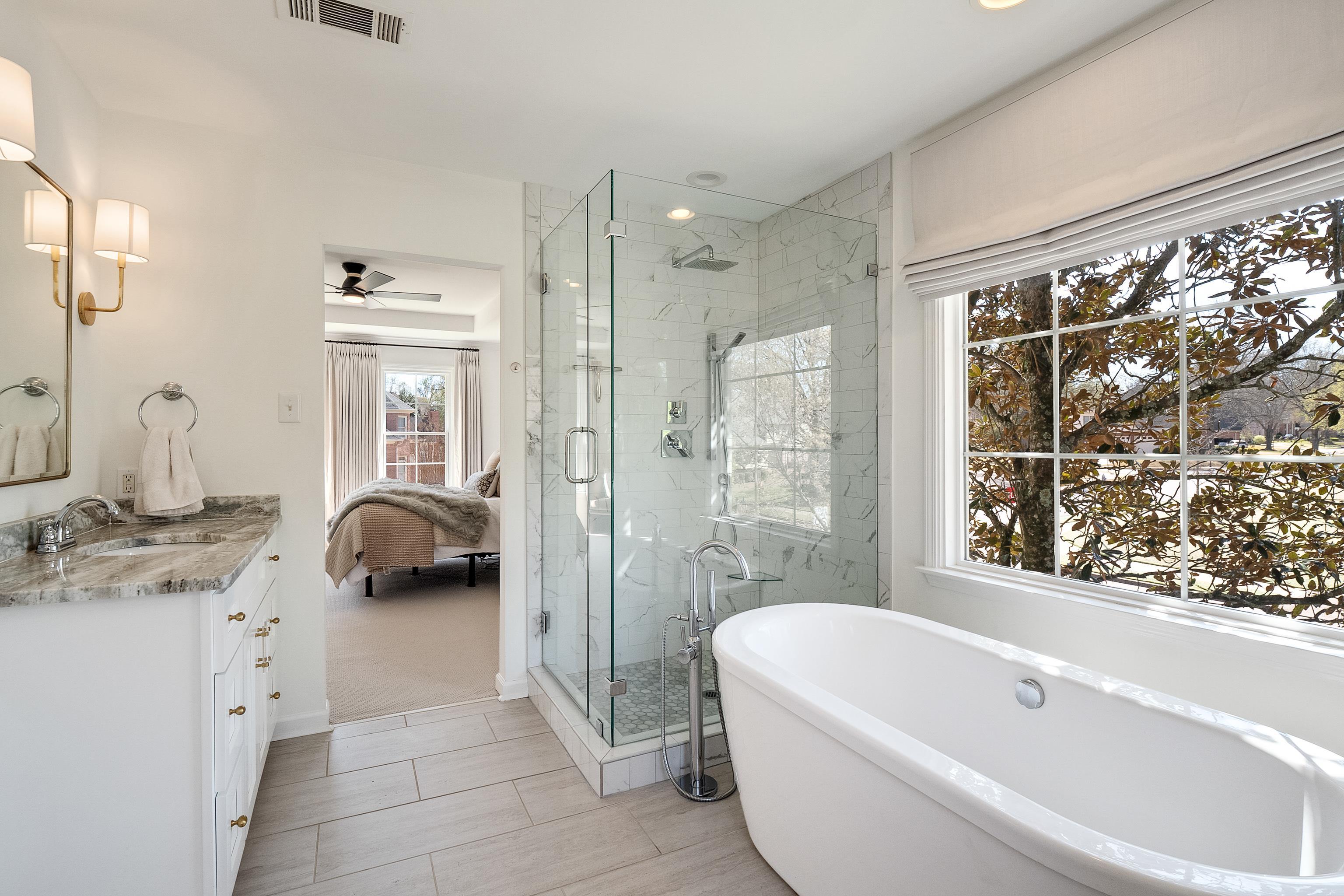 1870 Lonhill Drive Collierville, TN 38017 - Photo 21 of 34 a bathroom with a tub sink and mirror