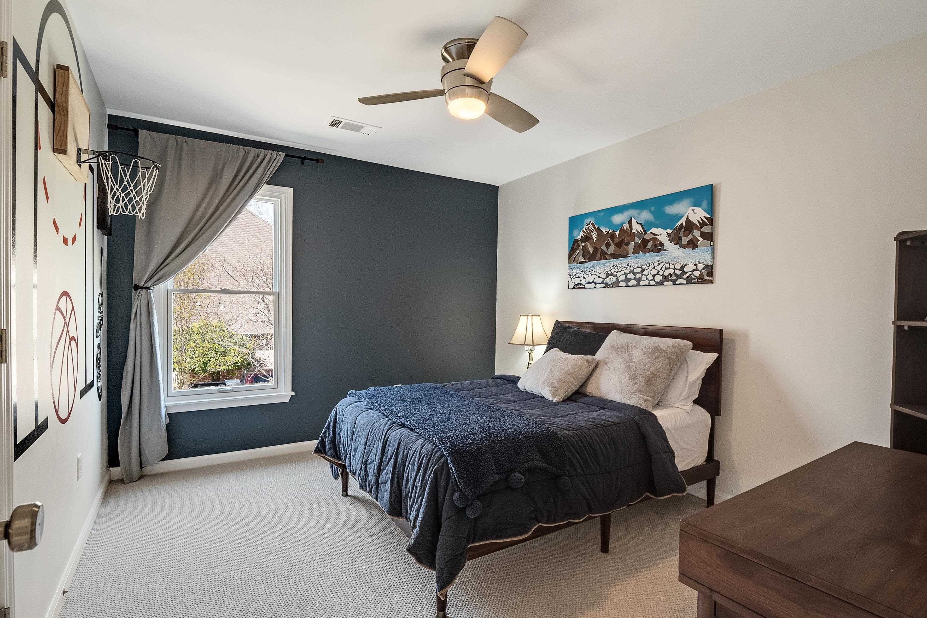 1870 Lonhill Drive Collierville, TN 38017 - Photo 23 of 34 a bedroom with a bed and a large window