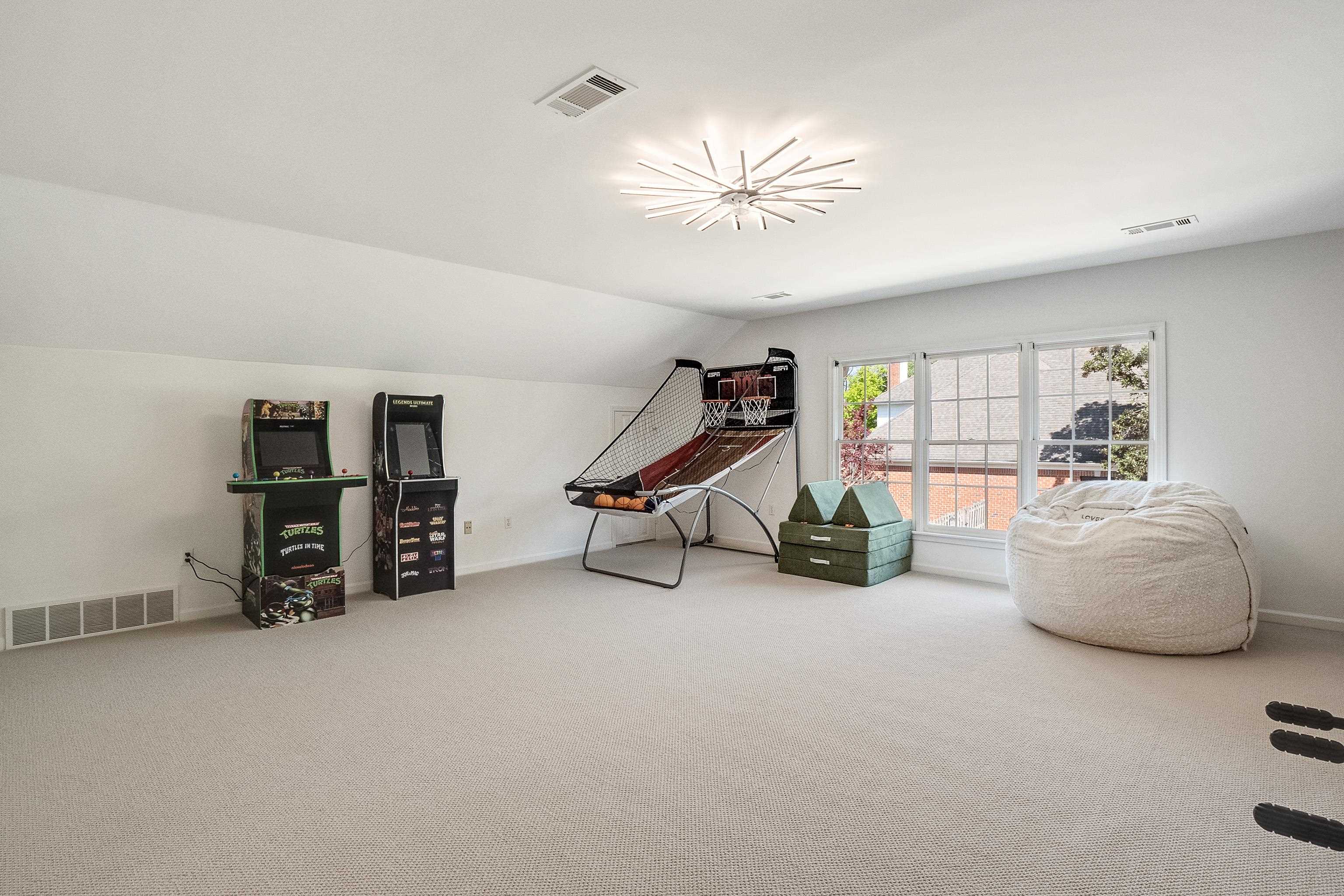 1870 Lonhill Drive Collierville, TN 38017 - Photo 27 of 34 a bedroom with furniture and a chandelier