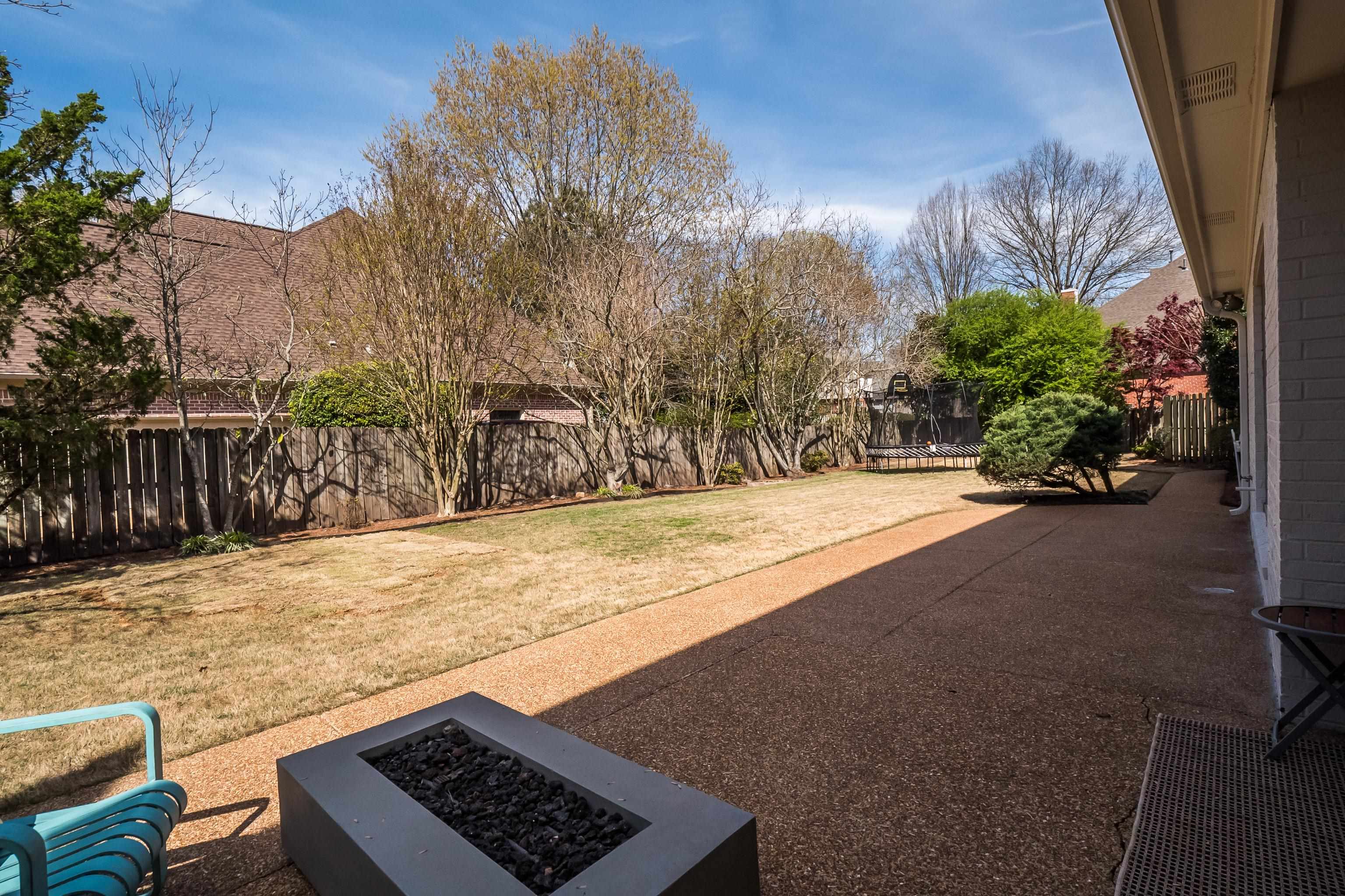 1870 Lonhill Drive Collierville, TN 38017 - Photo 28 of 34 a view of backyard with wooden fence and flowers