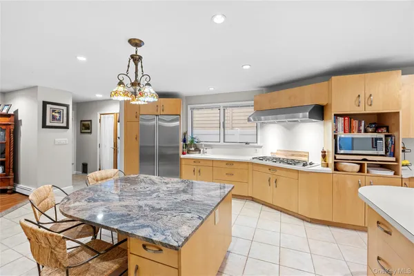 a kitchen with a sink cabinets and appliances