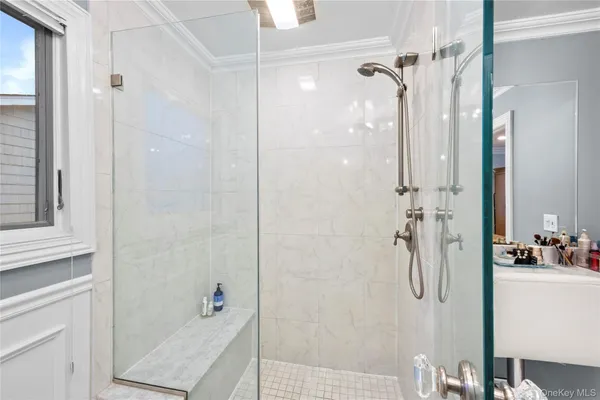 a bedroom with two beds and a wooden floor