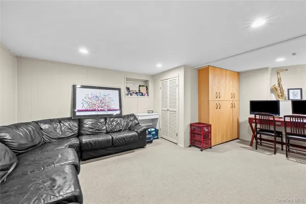 a living room with furniture window and a flat screen tv