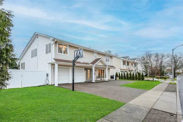 a view of a patio with table and chairs and potted plants