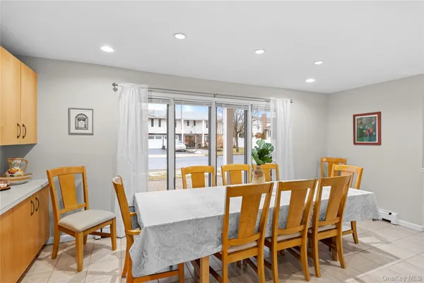 a large kitchen with a table and chairs in it