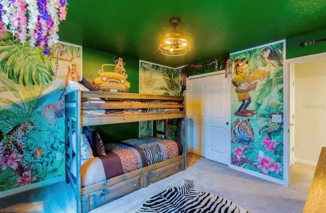 a outdoor living room with furniture and flowers