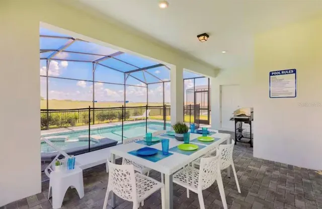 a view of a dining room with furniture window and outside view