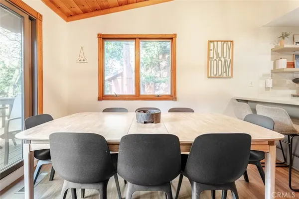 a view of a dining room with furniture window and outside view