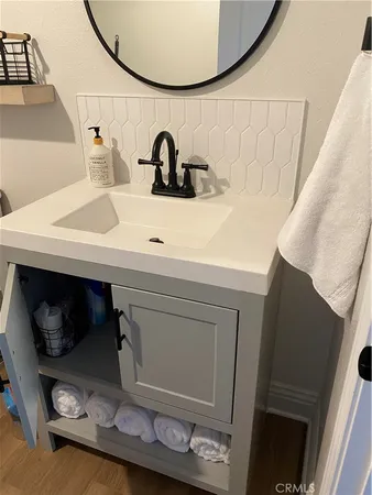a bathroom with a sink and a mirror