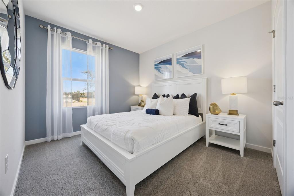 3019 House Finch Road St. Cloud, FL 34773 - Photo 13 of 54 a bed room with a bed and a window