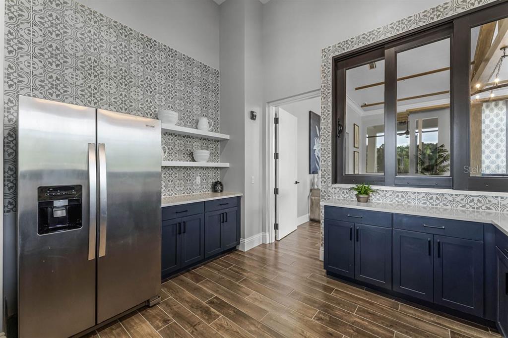 3019 House Finch Road St. Cloud, FL 34773 - Photo 25 of 54 a kitchen with stainless steel appliances granite countertop a refrigerator and a sink