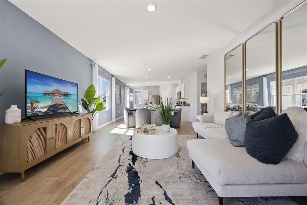 3019 House Finch Road St. Cloud, FL 34773 - Photo 5 of 54 a living room with furniture and a flat screen tv