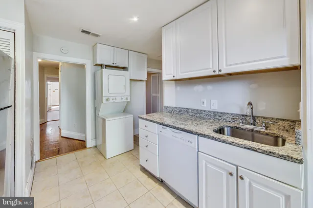 a kitchen with a sink and refrigerator
