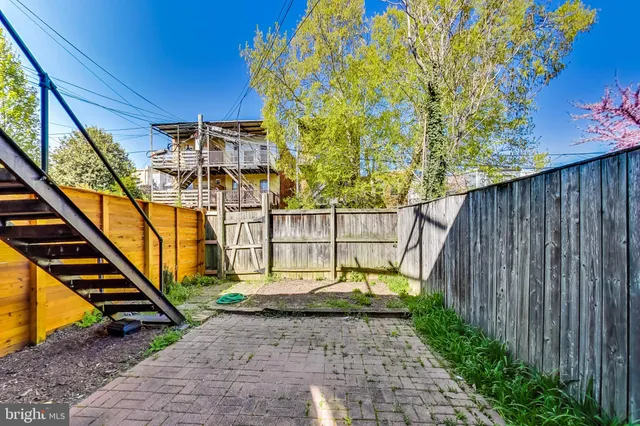 a view of a backyard with a small cabin