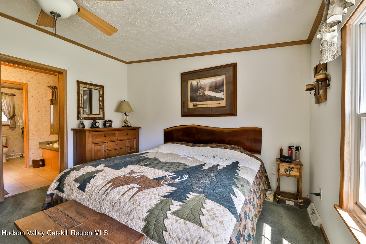 751 Mitchell Hollow Road Windham, NY 12496 - Photo 19 of 37 a bedroom with a bed and wooden floor
